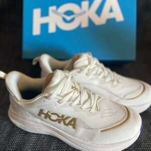 Hoka White and Gold Athletic Sneakers